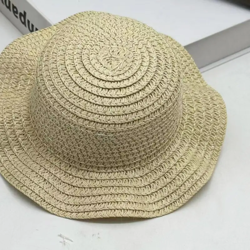 Close-up of a wavy brim mini straw hat
