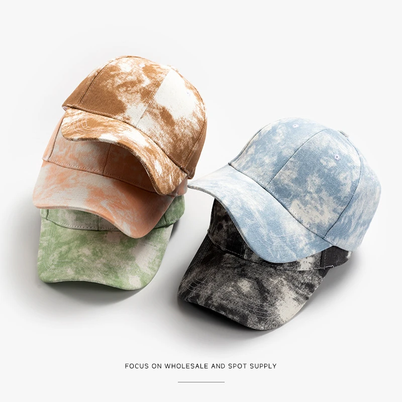 Tie-dye baseball caps in orange, green and blue