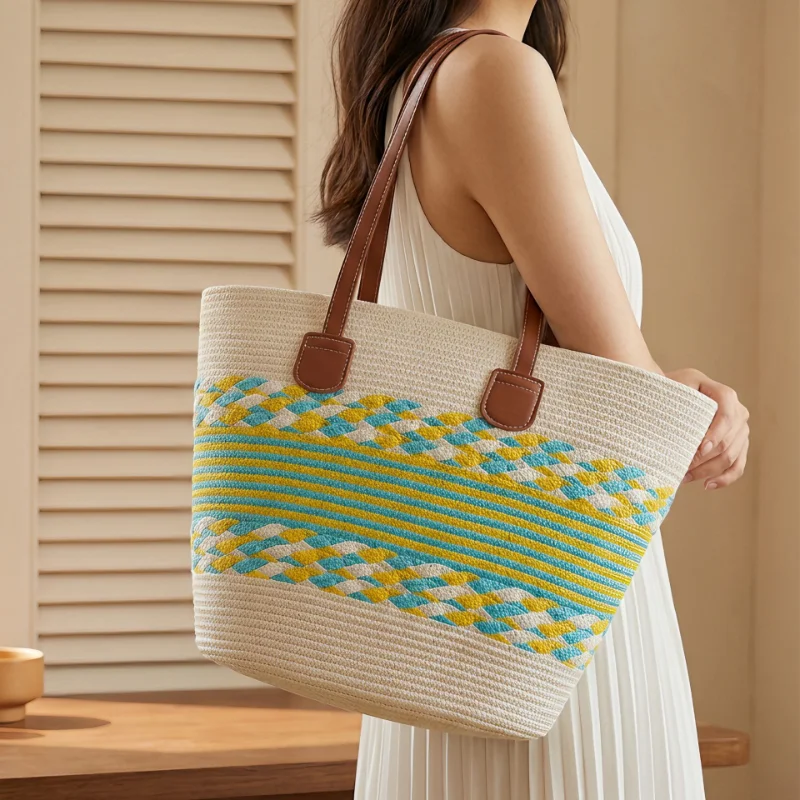 Woman carrying a grass green woven paper straw bag
