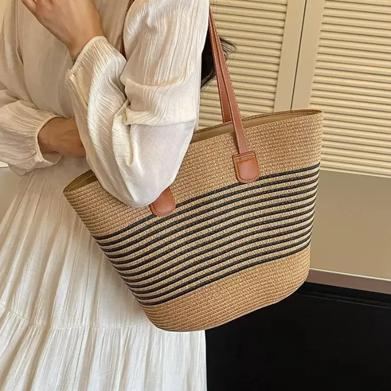 Woven straw shoulder bag with black and brown stripes